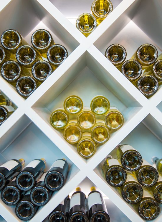 Wines White Wooden Shelve in Wines Cellar. Wines Selection.